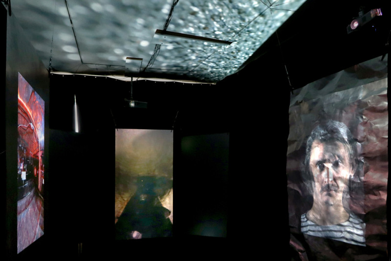 Various videos projected on steel plates and the ceiling